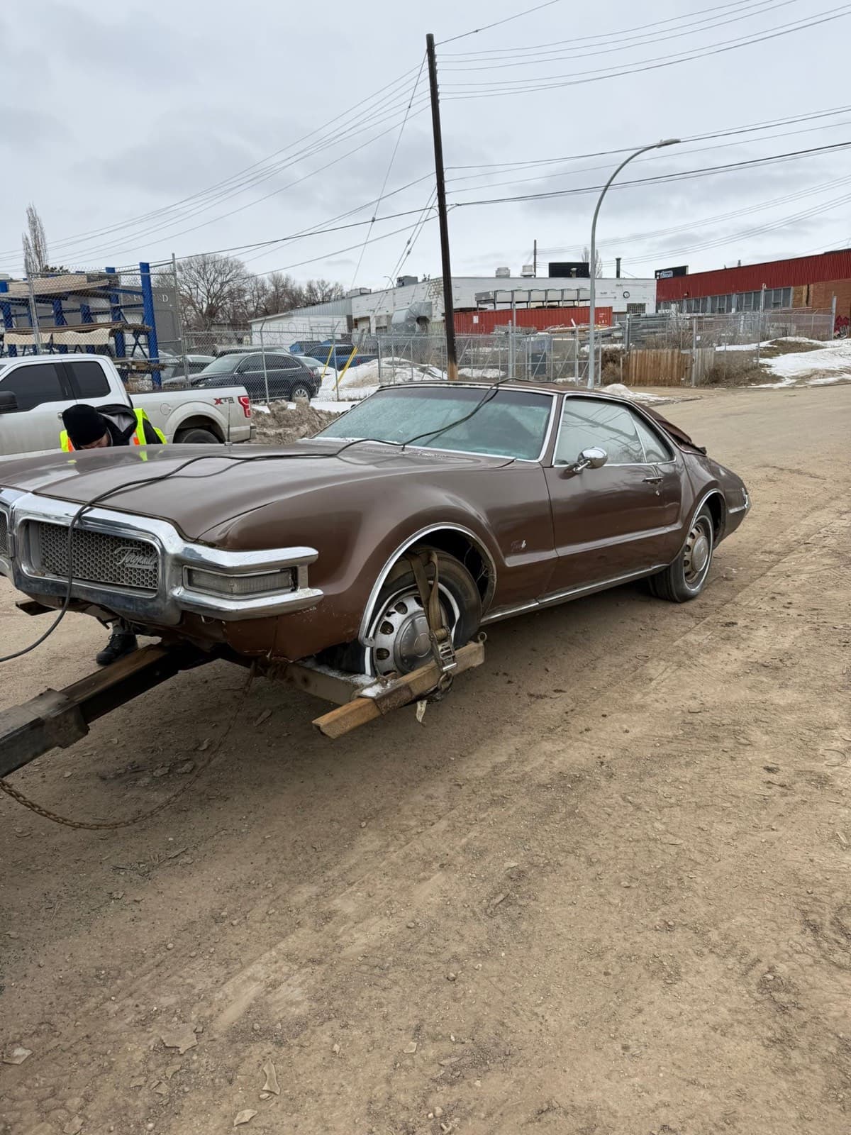 Classic Oldsmobile secured for junk car pickup serving Acheson Alberta