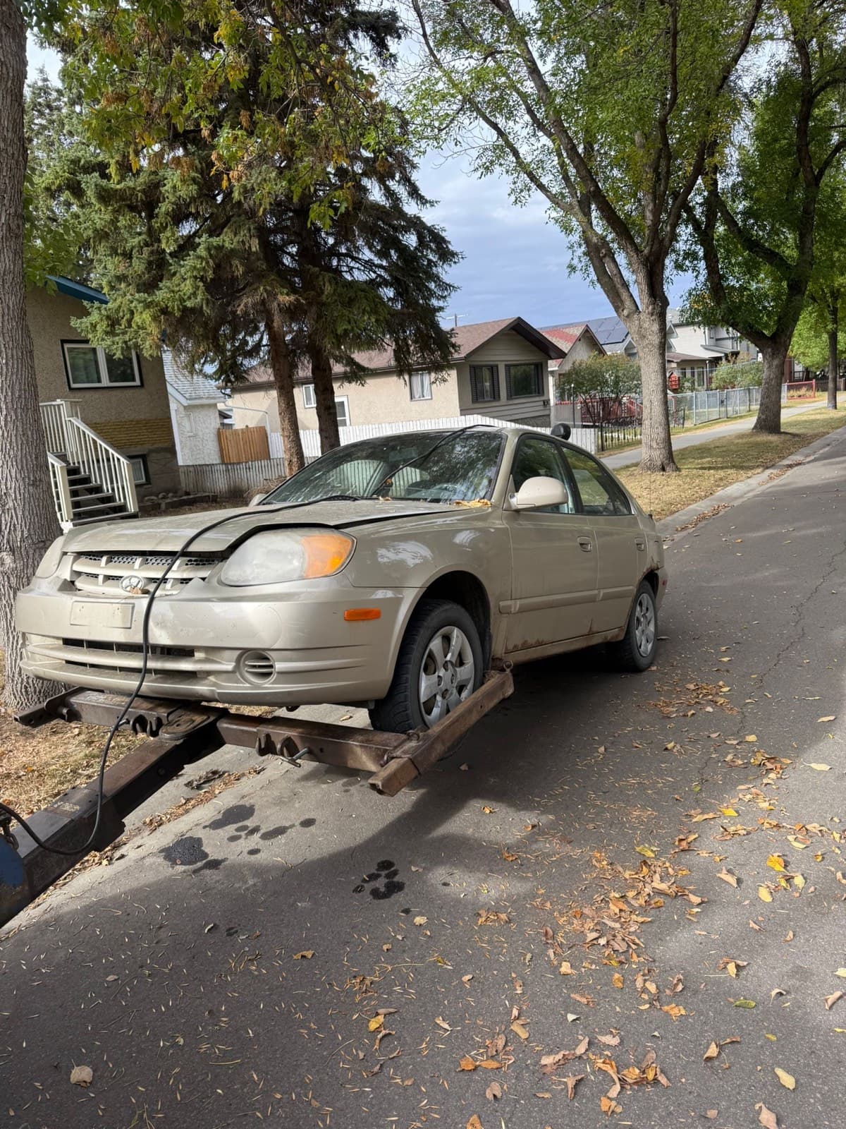 Damaged Hyundai Accent loaded for Millet cash for cars pickup