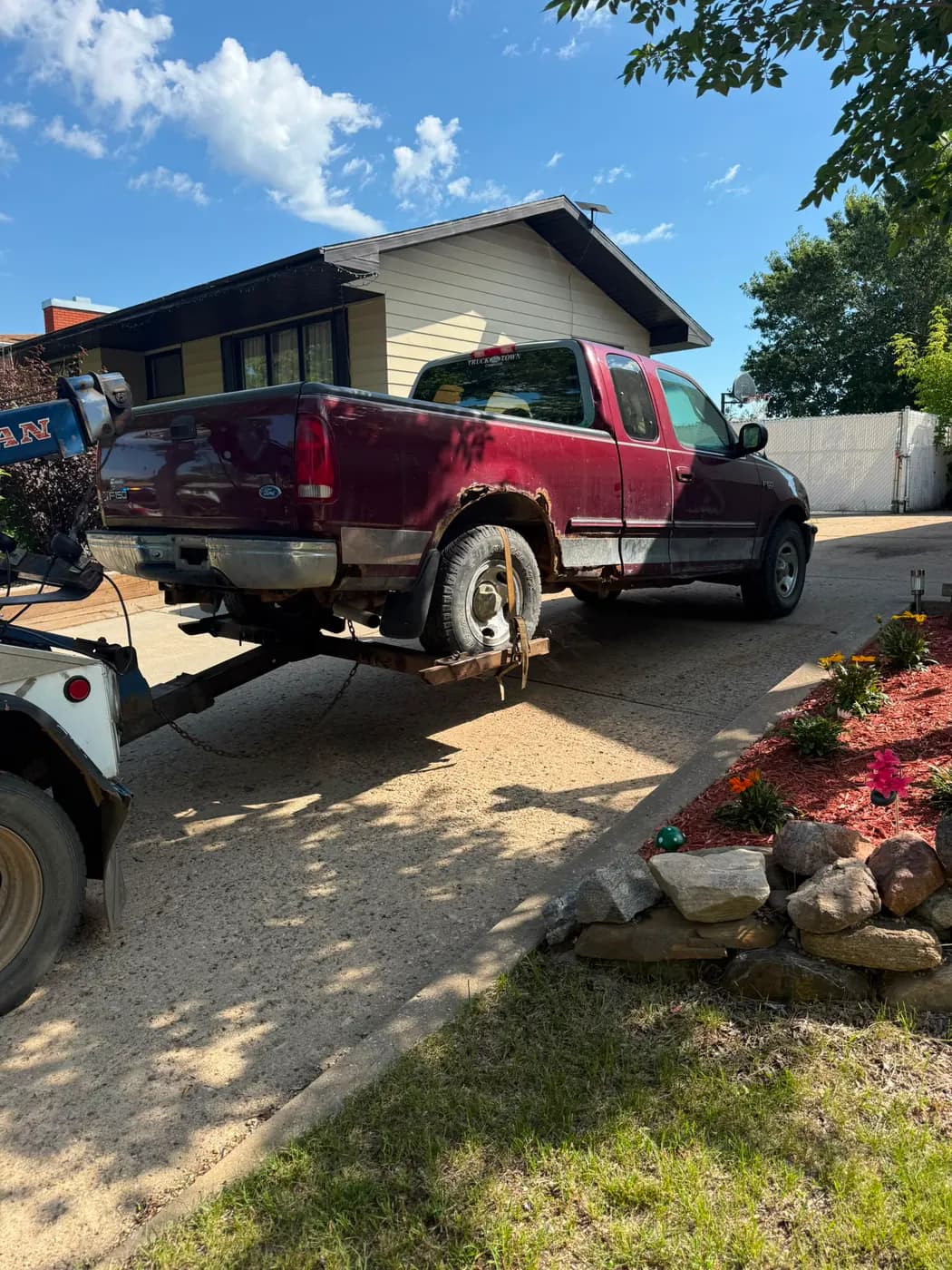 Red 2001 Ford F-150 collected for cash in downtown Fort Saskatchewan, Alberta