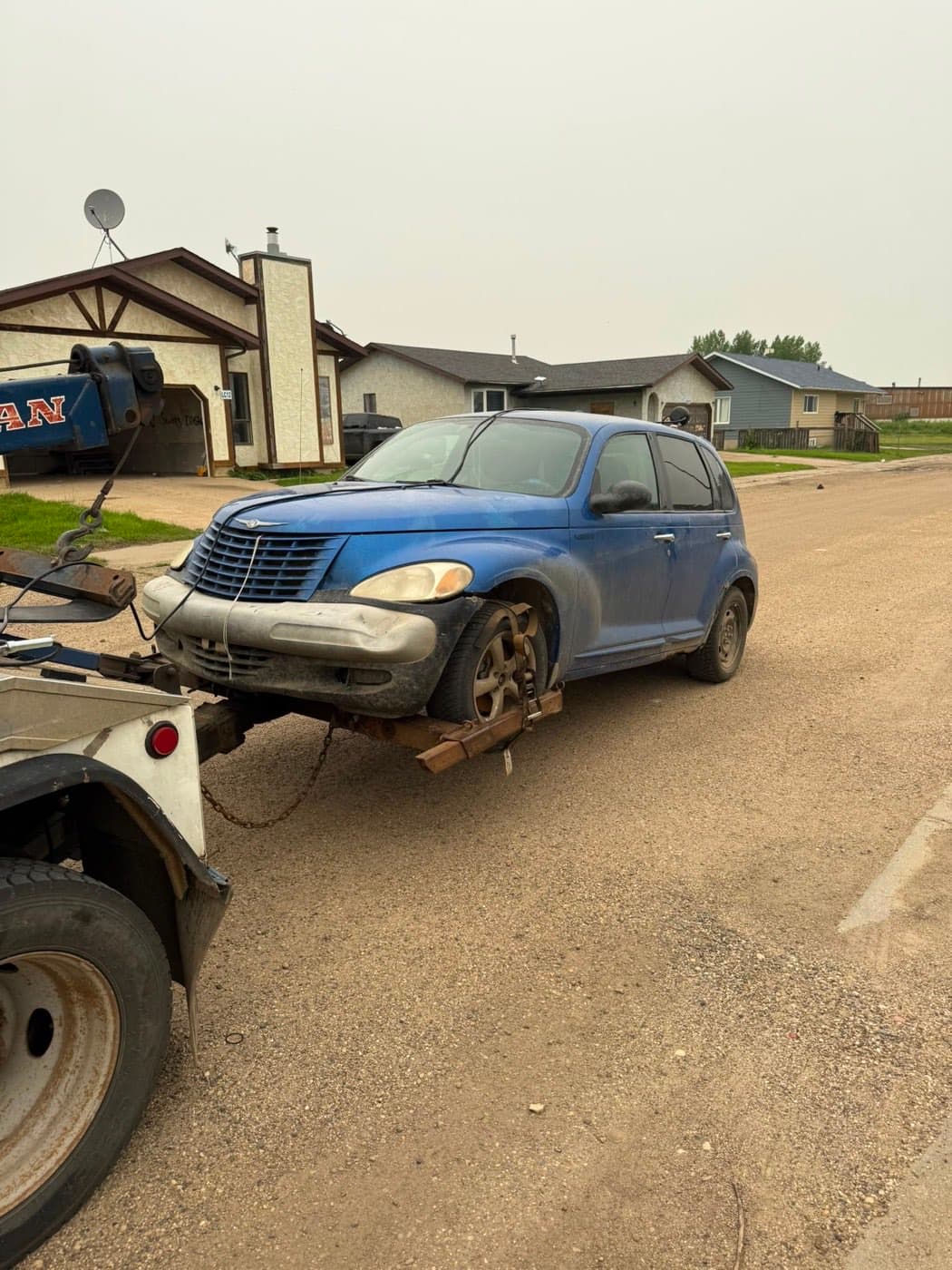 Blue 2003 Chrysler PT Cruiser collected for cash in central Maskwacis, Alberta