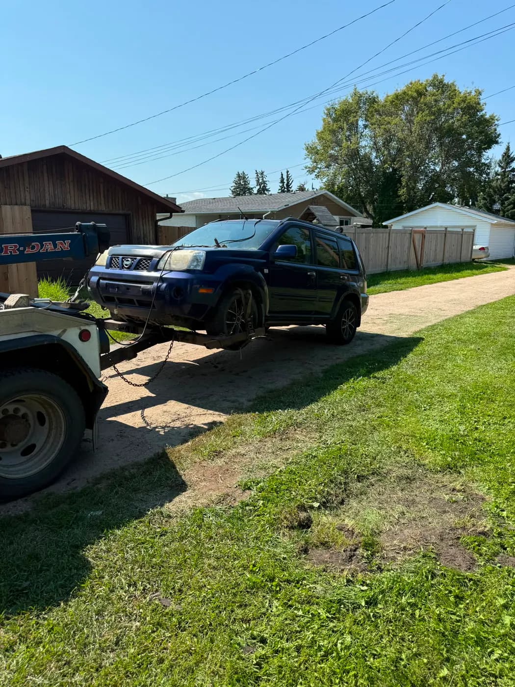 Black 2005 Nissan X-Trail collected for cash in downtown Wetaskiwin, Alberta