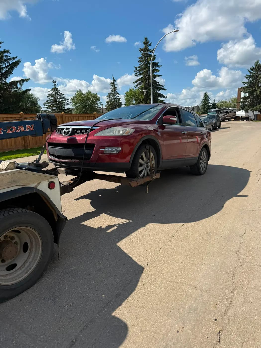 Red 2011 Mazda CX-9 collected for cash in La Perle, Edmonton