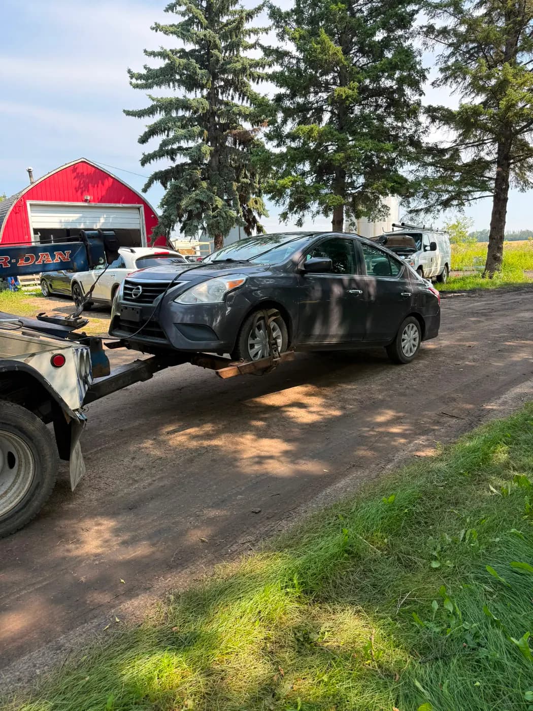 Black 2015 Nissan Versa collected for cash in Horse Hill, Edmonton